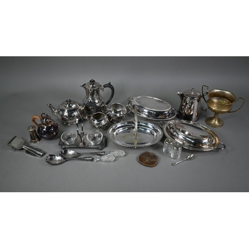 7 - An Arts & Crafts electroplated four-piece tea service of planished and riveted design, to/w two ... 