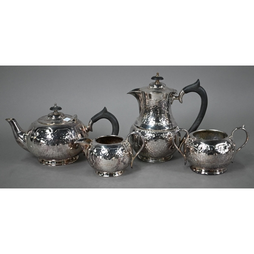 7 - An Arts & Crafts electroplated four-piece tea service of planished and riveted design, to/w two ... 
