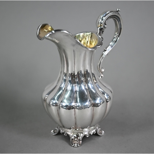 70 - A Victorian silver melon-shaped teapot with cast melon finial and scroll handle with ivory insulator... 