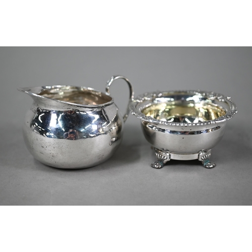 76 - A Regency Irish silver open salt, the egg and dart moulded rim with chased foliate and shell decorat... 