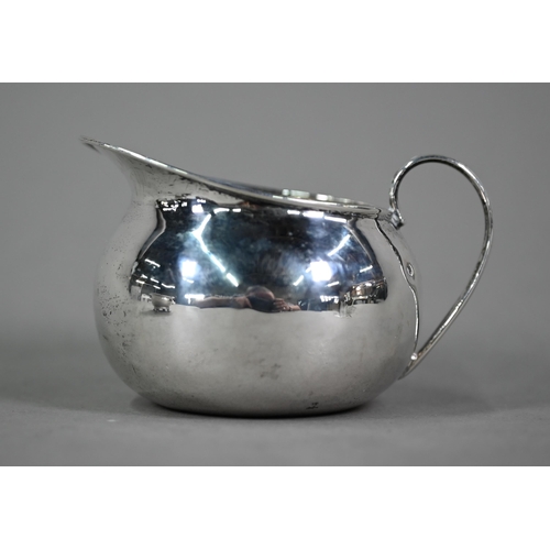 76 - A Regency Irish silver open salt, the egg and dart moulded rim with chased foliate and shell decorat... 