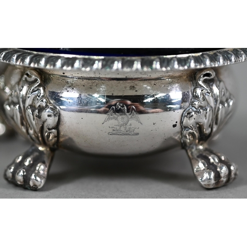 77 - A pair of William IV silver circular open salts in the Regency manner, with blue glass liners and  g... 