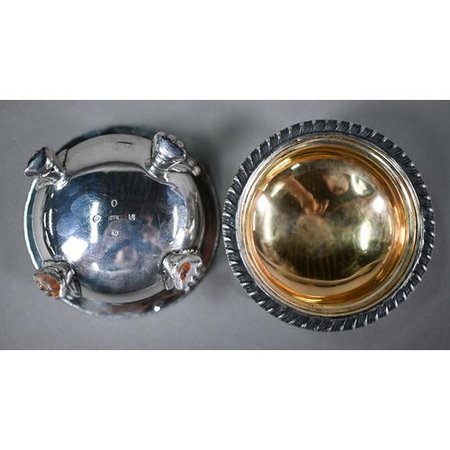 77 - A pair of William IV silver circular open salts in the Regency manner, with blue glass liners and  g... 