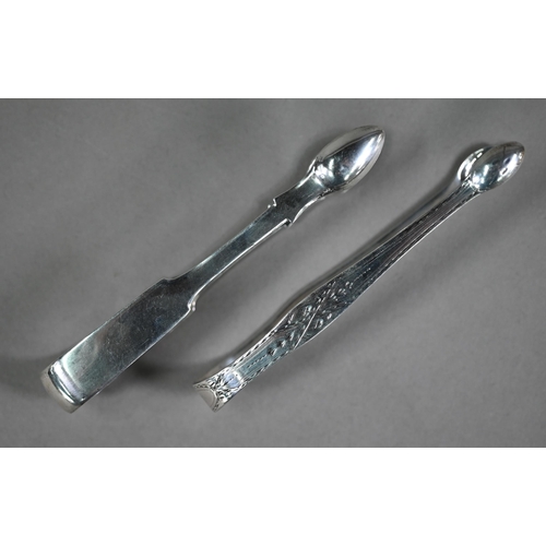 85 - Hester Bateman: a pair of bright-cut sugar tongs, assay and maker's marks only, to/w a pair of Georg... 