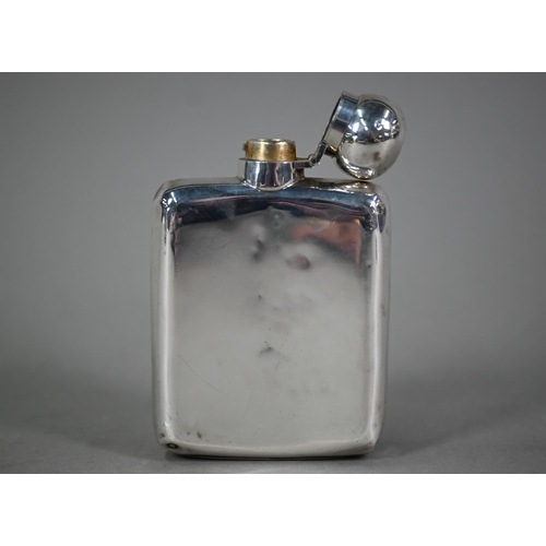 88 - A silver hip flask, the hinged bun cover with bayonet closure, Goldsmiths & Silversmiths Co. Ltd... 