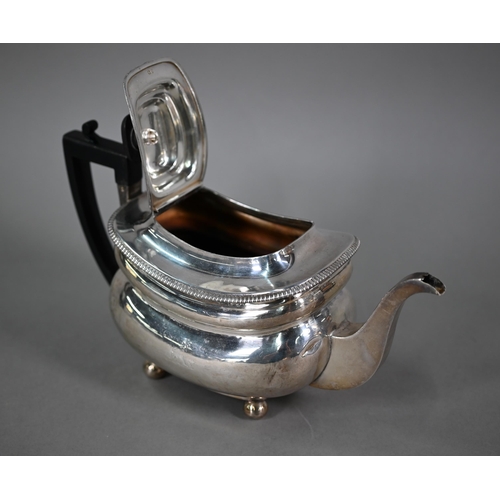 91 - A George III silver teapot of oblong form, with ebonised finial and handle, egg and dart moulded rim... 