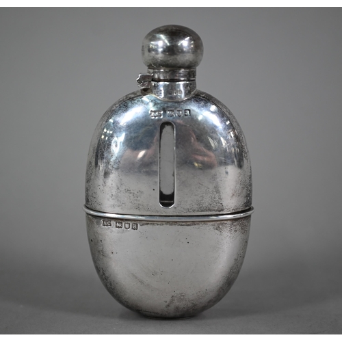 97 - Late Victorian silver-clad oval glass hip-flask with hinged bayonet bun cover and detachable beaker,... 