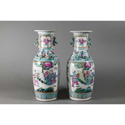 450 - A pair of 19th century Chinese Canton famille rose vases of baluster form with everted foliate rims,... 