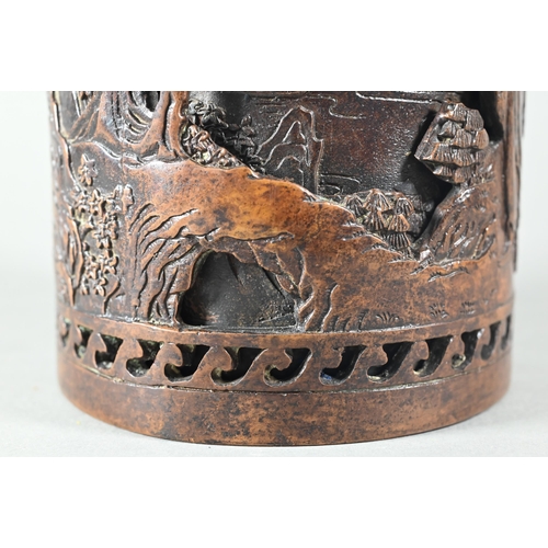 454 - A Chinese double-walled cylindrical bronze brush pot, bitong, cast in relief with pagodas and figure... 