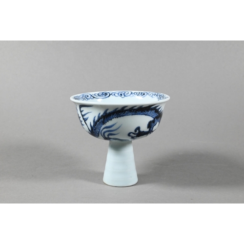 473 - A Chinese blue and white 'Dragon' stem cup in the late Yuan/early Ming dynasty style, painted in und... 