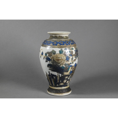 505 - A 19th century Japanese vase of flattened oval form with applied dragon around the short neck, paint... 