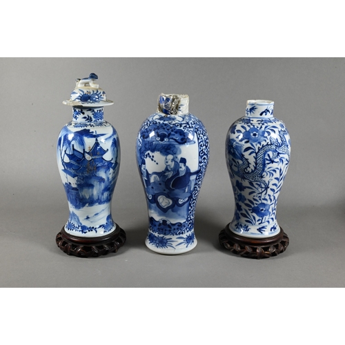 512 - A 19th century Chinese blue and white baluster vase painted in underglaze blue with figures in pagod... 