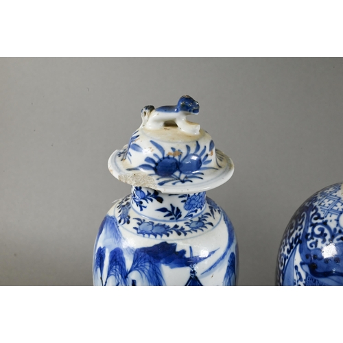 512 - A 19th century Chinese blue and white baluster vase painted in underglaze blue with figures in pagod... 