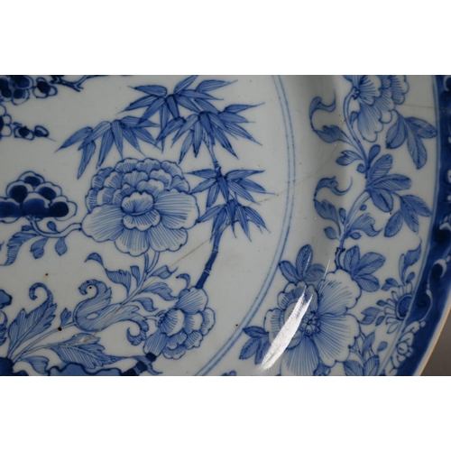 514 - An 18th century Chinese blue and white octagonal plate painted with pagoda landscape design and flor... 