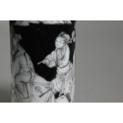 515 - A 19th century Chinese black ground en-grisaille porcelain snuff bottle of high shouldered cylindric... 