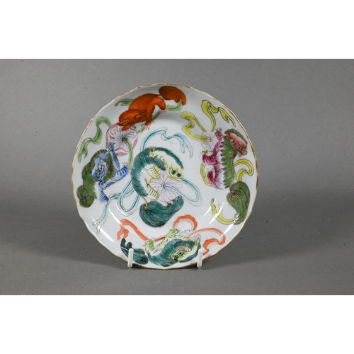 526 - A 19th century Chinese famille rose scalloped dish painted in bright polychrome enamels with five Bu... 