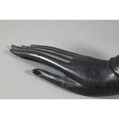 528 - A 18th/19th century Thai bronze 'hand of Buddha' desk weight with long slender digits and vestigial ... 