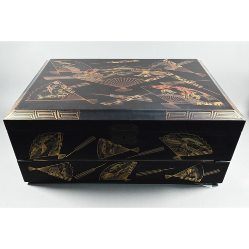 530 - An early 20th century Japanese black lacquered brass mounted writing box with twin hinged top and fi... 