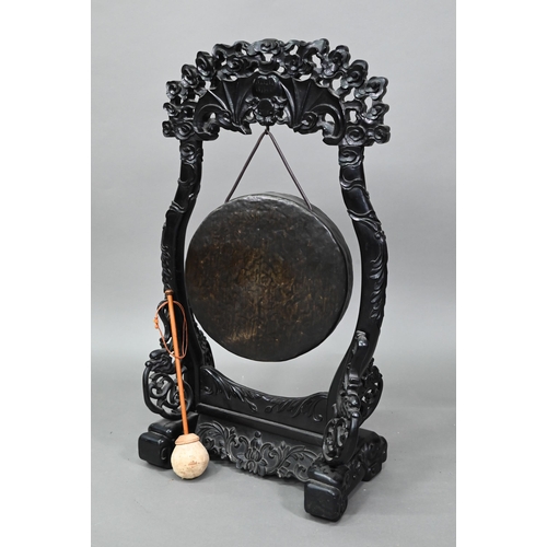 533 - A 19th century Chinese circular bronze gong suspended from the ebonized hardwood frame (later replac... 