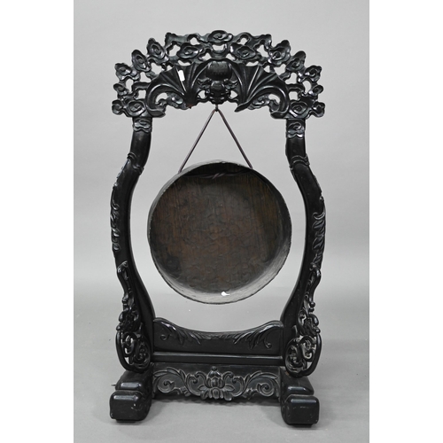 533 - A 19th century Chinese circular bronze gong suspended from the ebonized hardwood frame (later replac... 