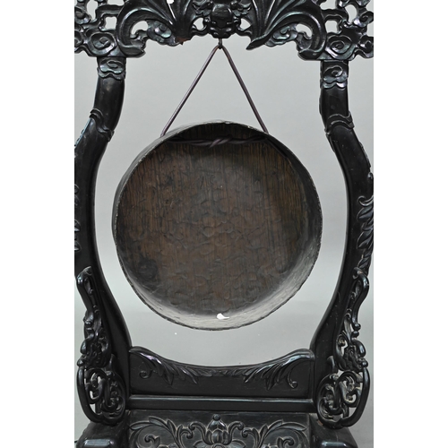 533 - A 19th century Chinese circular bronze gong suspended from the ebonized hardwood frame (later replac... 