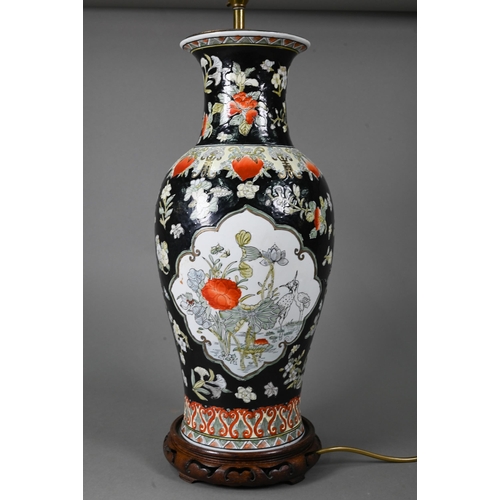 540 - A late 19th or early 20th century Chinese famille noire style baluster vase (drilled and mounted as ... 