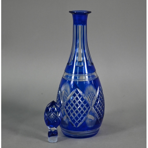 553 - A blue flash cut glass decanter and stopper, to/w six wine glasses