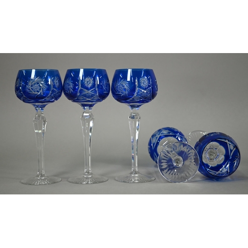 553 - A blue flash cut glass decanter and stopper, to/w six wine glasses