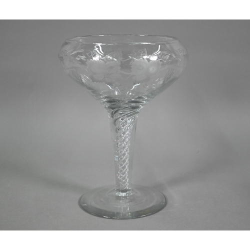 556 - A large glass goblet with vine-etched bowl on airtwist stem, ground out pontil to base, 30 cm high x... 