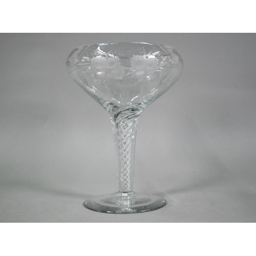 556 - A large glass goblet with vine-etched bowl on airtwist stem, ground out pontil to base, 30 cm high x... 