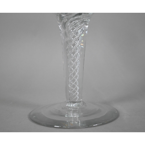 556 - A large glass goblet with vine-etched bowl on airtwist stem, ground out pontil to base, 30 cm high x... 