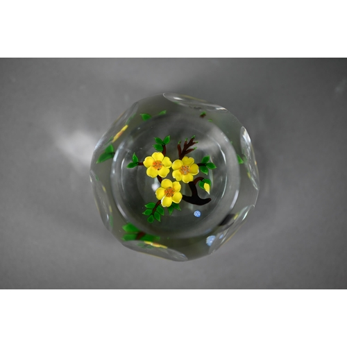 562 - A floral specimen paperweight with 'J' cane - possibly John Deacons, 7.5 cm diam to/w two millefiori... 