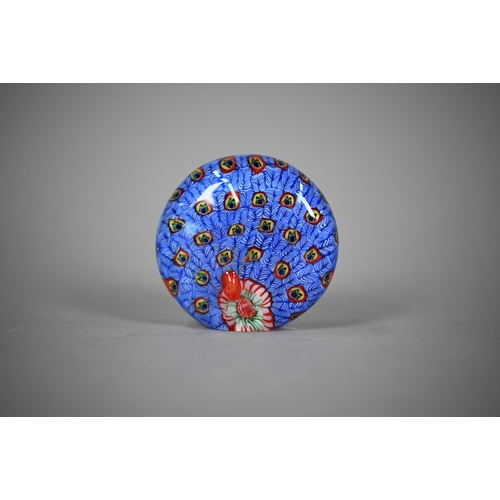 562 - A floral specimen paperweight with 'J' cane - possibly John Deacons, 7.5 cm diam to/w two millefiori... 