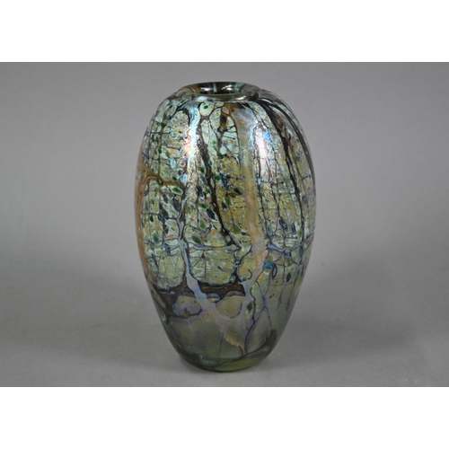 565 - Peter Layton (b 1937) - An iridescent glass ovoid vase with abstract streaked and hatched decoration... 