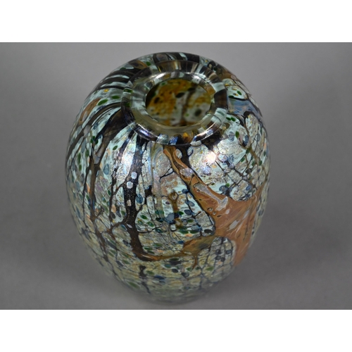 565 - Peter Layton (b 1937) - An iridescent glass ovoid vase with abstract streaked and hatched decoration... 