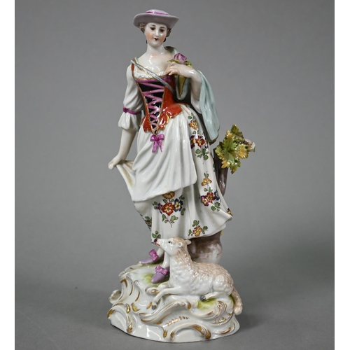 573 - A Naples china figure of a shepherdess, 20 cm high to/w a Continental bonbon dish with floral encrus... 