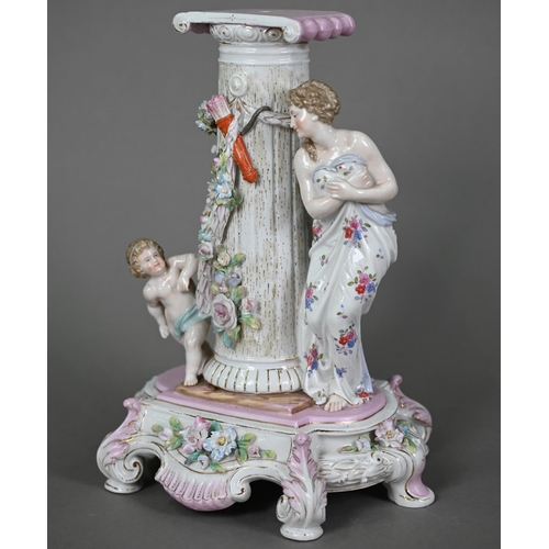 578 - A German porcelain pedestal, modelled with a shy maiden playing hide and seek with Cupid around a fl... 