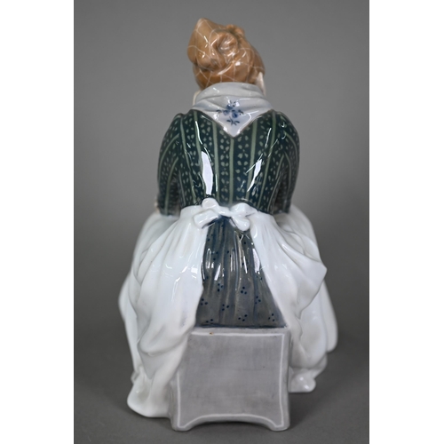 586 - A Royal Copenhagen figure, Fanoe girl, seated and bored, 1324, 21 cm