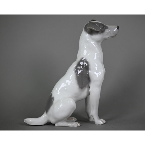 589 - A Royal Copenhagen seated terrier 1452/753, (underglaze blue L Nr 870A and wave mark), 23 cm high