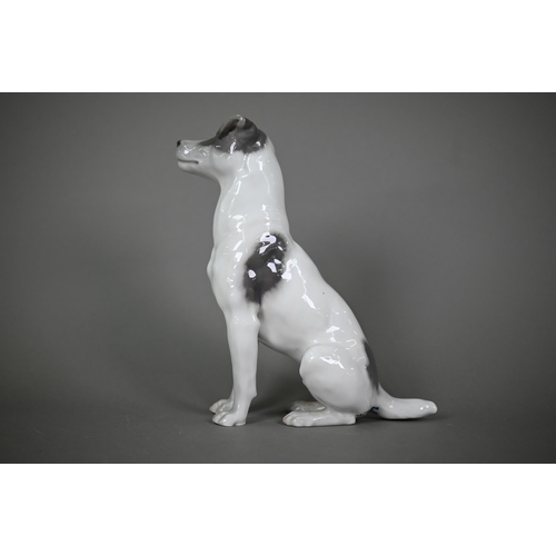 589 - A Royal Copenhagen seated terrier 1452/753, (underglaze blue L Nr 870A and wave mark), 23 cm high