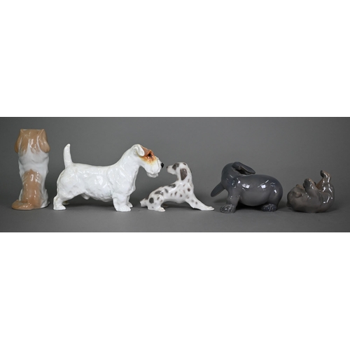 590 - Four Royal Copenhagen dogs, Puppy chasing its tail 1238 and Puppy Rolling 124, Pekinese begging 1776... 