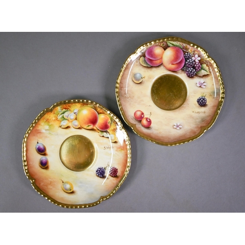 597 - A pair of Royal Worcester cabinet tea cups and saucers, painted with fruit still lives, signed S. Wo... 