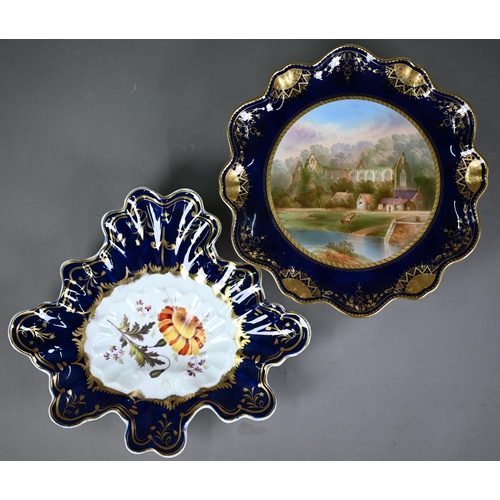 609 - A Victorian Minton china wall-plate painted with 'A View in The Vale of Llangollen' (title on revers... 