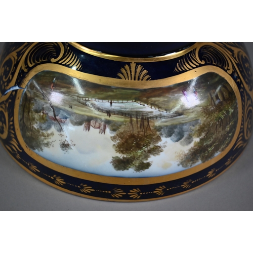 613 - A Samson of Paris porcelain punch-bowl in the 18th century Derby manner, the blue and gilt ground wi... 