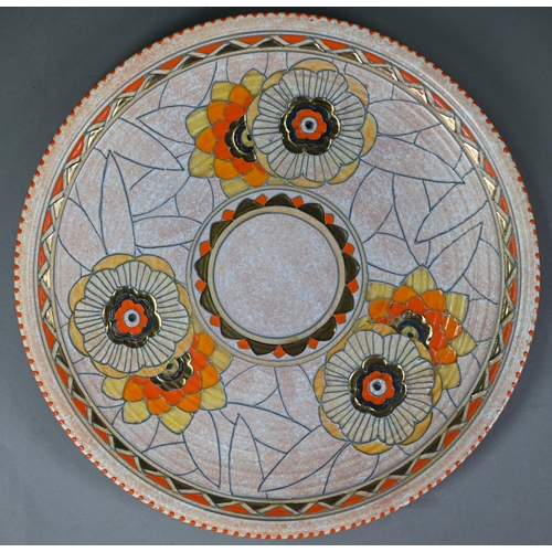 619 - A Crown Ducal 25 cm diameter bowl with tubeline scrolling decoration by Charlotte Rhead (signed), to... 