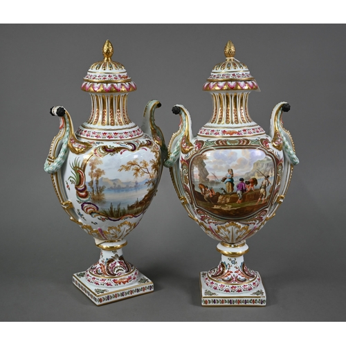 A pair of 19th century French porcelain vases, the domed covers with fir-cone finials, the twin handles with bronze rosette mounts, reserves well-painted with 18th century figures on a lake shoreline, lake landscapes to reverse, signed J. Vernet, on stemmed foot with square base, underglaze blue crowned JB monogram under base, 51 cm