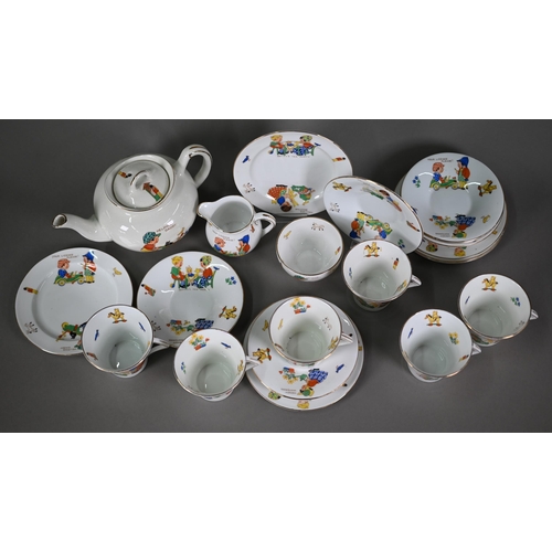 629 - An Art Deco Colclough china nursery tea service for six, printed with young children and their toys,... 