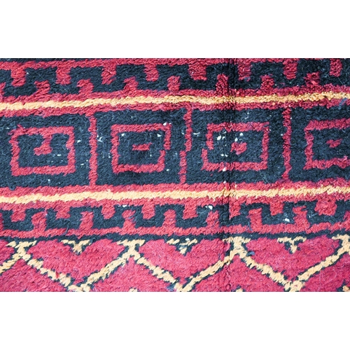 830 - An old Persian-Kurd Uzbek Hoten design rug, red, 242 cm x 149 cm