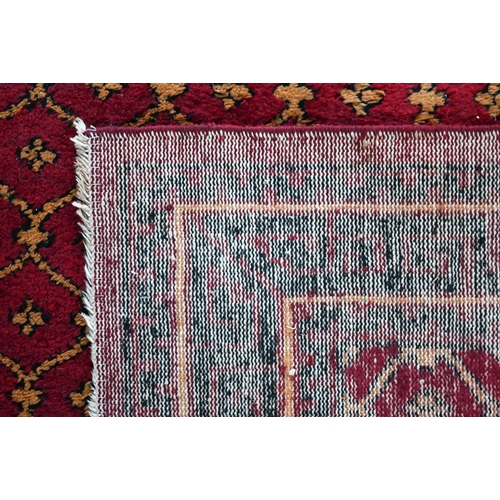 830 - An old Persian-Kurd Uzbek Hoten design rug, red, 242 cm x 149 cm