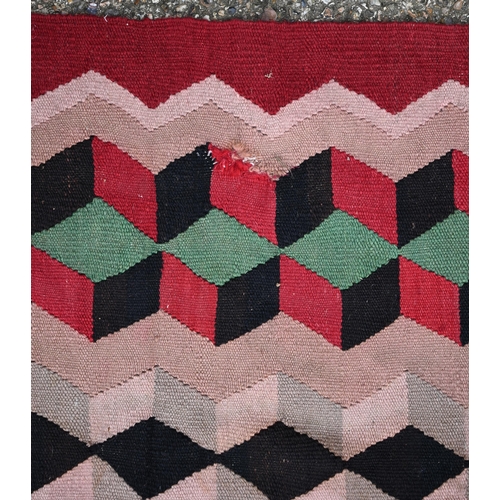 838 - An old Turkish Kelim, the red ground with geometric designs, 277 cm x 196 cm